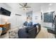 Cozy living room with coastal decor, comfortable seating, and an open layout leading to the kitchen at 3509 S Atlantic Ave # 102 And 103, New Smyrna Beach, FL 32169