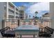 Inviting patio view overlooking the sparkling pool and well-maintained condo grounds, with comfortable seating at 3509 S Atlantic Ave # 102 And 103, New Smyrna Beach, FL 32169