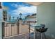 Balcony view of the pool and surrounding landscaped grounds, creating a relaxing outdoor space at 3509 S Atlantic Ave # 102 And 103, New Smyrna Beach, FL 32169