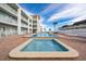 Community pool with inviting splash pools, lounging areas, and resort-style amenities at 3509 S Atlantic Ave # 102 And 103, New Smyrna Beach, FL 32169