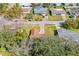 Aerial view of home nestled among mature trees in a residential neighborhood at 3610 Donna St, Port Orange, FL 32129