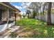 Lush backyard with a shed, surrounded by mature trees and a privacy fence at 3610 Donna St, Port Orange, FL 32129