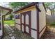 Well-maintained storage shed in a backyard setting, providing ample space for storing tools and equipment at 3610 Donna St, Port Orange, FL 32129