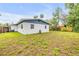 A spacious backyard featuring a well-maintained lawn that offers plenty of room to enjoy at 3718 Paige St, Port Orange, FL 32129