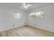 Bedroom with wood floors and large windows that bring in lots of natural light at 3718 Paige St, Port Orange, FL 32129