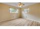 Bedroom with wood floors and windows overlooking the backyard at 3718 Paige St, Port Orange, FL 32129