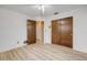 Bedroom features wood floors, a ceiling fan, and double door closets at 3718 Paige St, Port Orange, FL 32129