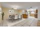 Dining room with tile floors, a modern table set, and a view into the kitchen at 3718 Paige St, Port Orange, FL 32129