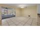 Dining room with sliding door access to a screened patio and neutral tile flooring at 3718 Paige St, Port Orange, FL 32129