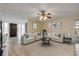Inviting living room with a ceiling fan, neutral walls, and a view into the entryway at 3718 Paige St, Port Orange, FL 32129