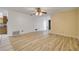 Inviting living room featuring wood floors, a ceiling fan, and lots of natural light at 3718 Paige St, Port Orange, FL 32129
