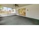 A screened-in porch with a sliding door that leads to the outside for an easy indoor-outdoor flow at 3718 Paige St, Port Orange, FL 32129