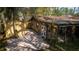 Charming backyard with a unique checkered patio and sunroom, great for outdoor living and entertaining at 3736 Paige St, Port Orange, FL 32129
