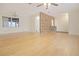Spacious living room area with hardwood floors and a charming brick accent wall at 3736 Paige St, Port Orange, FL 32129