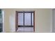 Open doorway view of bright sunroom with large windows and tile floors, enhancing natural light at 3736 Paige St, Port Orange, FL 32129
