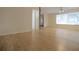 Bright living room showcasing neutral paint, light wood flooring, and a ceiling fan at 3736 Paige St, Port Orange, FL 32129