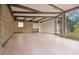 Bright sunroom with large windows, beamed ceilings, and tile flooring, seamlessly blending indoor and outdoor spaces at 3736 Paige St, Port Orange, FL 32129