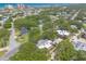 Aerial view displaying homes nestled among trees near the beach at 3808 Saxon Dr, New Smyrna Beach, FL 32169