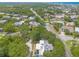 Aerial view of tree-lined neighborhood streets with homes at 3808 Saxon Dr, New Smyrna Beach, FL 32169