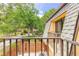 Balcony view overlooking mature trees and a courtyard in a residential community at 3808 Saxon Dr, New Smyrna Beach, FL 32169