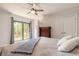 Bright bedroom with natural light and a cozy ambiance with balcony access and closet at 3808 Saxon Dr, New Smyrna Beach, FL 32169