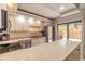 The kitchen has a large island with room for dining, stainless appliances, and ample counter space at 3808 Saxon Dr, New Smyrna Beach, FL 32169