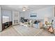 Bright living room with modern decor, ceiling fan and fireplace at 3808 Saxon Dr, New Smyrna Beach, FL 32169