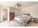 Comfortable bedroom with a ceiling fan, neutral walls, and ample closet space at 3808 Saxon Dr, New Smyrna Beach, FL 32169