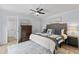 Comfortable main bedroom with an upholstered headboard and neutral decor at 3808 Saxon Dr, New Smyrna Beach, FL 32169