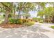 Street view of community with mature landscaping and trees at 3808 Saxon Dr, New Smyrna Beach, FL 32169