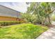Lush backyard with a bench perfect for relaxation and enjoyment of the outdoors at 3808 Saxon Dr, New Smyrna Beach, FL 32169
