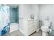 Compact bathroom with a patterned shower curtain, storage vanity, and modern toilet for comfort and convenience at 3855 S Atlantic Ave # 1503, Daytona Beach Shores, FL 32118