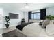 Stylish bedroom with ocean view, featuring modern furnishings, dark curtains, and an inviting decor at 3855 S Atlantic Ave # 1503, Daytona Beach Shores, FL 32118