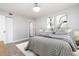 Well-lit bedroom with neutral walls, tile floors, closet, and art pieces at 3855 S Atlantic Ave # 1503, Daytona Beach Shores, FL 32118