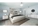 Bedroom with light-blue walls, decorative art, and soft lighting, creating a calming and elegant retreat at 3855 S Atlantic Ave # 1503, Daytona Beach Shores, FL 32118