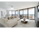 Living room with ocean views, neutral-tone furniture, ample seating, and natural light at 3855 S Atlantic Ave # 1503, Daytona Beach Shores, FL 32118