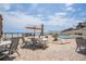 Enjoy the outdoor pool deck with dining tables, umbrellas, and ocean views at 3855 S Atlantic Ave # 1503, Daytona Beach Shores, FL 32118
