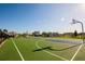Community basketball court on a sunny day, surrounded by green space and residential homes at 3963 Willowbrook Dr, Edgewater, FL 32141
