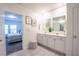 Bright bathroom featuring double sinks, decor and neutral color palette at 3963 Willowbrook Dr, Edgewater, FL 32141