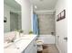 Bathroom featuring gray tile in the bath/shower and white cabinets at 3963 Willowbrook Dr, Edgewater, FL 32141