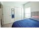 Comfortable bedroom featuring neutral colors, soft carpet, and a light-filled window at 3963 Willowbrook Dr, Edgewater, FL 32141