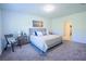 Comfortable bedroom with neutral colors, soft carpet, and a light-filled window at 3963 Willowbrook Dr, Edgewater, FL 32141