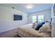 This bedroom features plush carpet, and a wall-mounted television at 3963 Willowbrook Dr, Edgewater, FL 32141