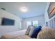This bedroom features plush carpet, and a wall-mounted television at 3963 Willowbrook Dr, Edgewater, FL 32141