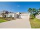 Charming single-Gathering home featuring a lush lawn, a neatly kept yard, and a two-car garage at 3963 Willowbrook Dr, Edgewater, FL 32141