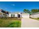 Charming single-Gathering home featuring a lush lawn, a neatly kept yard, and a two-car garage at 3963 Willowbrook Dr, Edgewater, FL 32141