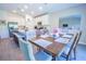 Bright kitchen with white cabinetry, stainless steel appliances, and a large island with bar stool seating at 3963 Willowbrook Dr, Edgewater, FL 32141