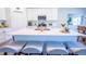 Bright kitchen island with seating, stainless steel appliances, and an open design at 3963 Willowbrook Dr, Edgewater, FL 32141