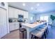 Spacious kitchen with island seating flows into the dining area, ideal for entertaining and Gathering meals at 3963 Willowbrook Dr, Edgewater, FL 32141