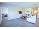 Cozy living room offers stylish furnishings, ample natural light, and seamless access to other areas of the home at 3963 Willowbrook Dr, Edgewater, FL 32141